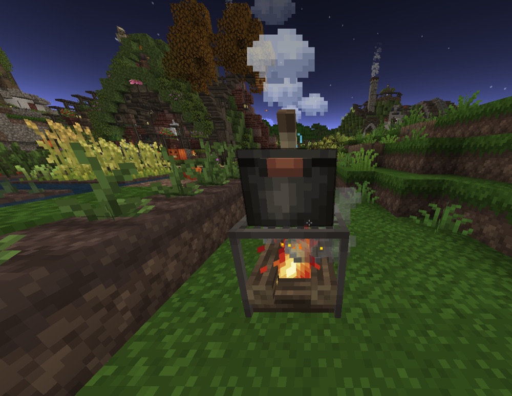 A Cooking Pot placed over a campfire.